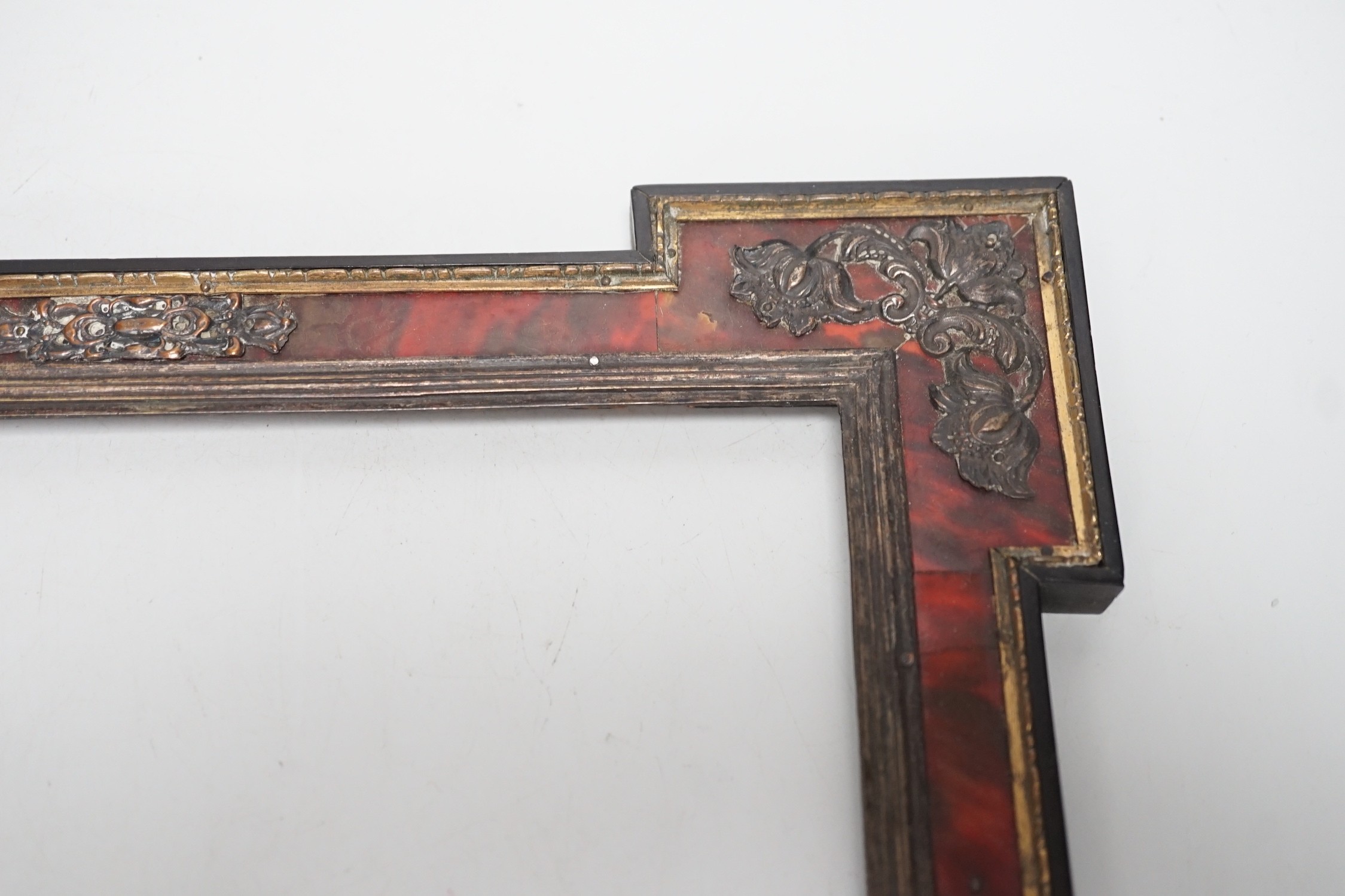 A 19th century red tortoiseshell and metal mounted picture frame. 27 x 31cm
